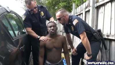 Two police officers take advantages of this black guy all gay porn video