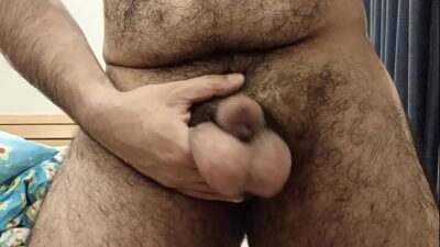Sexy boy swings his huge nuts while he jacks off all gay porn video