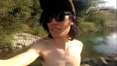 Jon Arteen is this slim Asian twink boy dancing a musical strip-tease on the river smiling showing his full pubes doing outdoor gay porn with a sneaker and underwear fetish all gay porn video